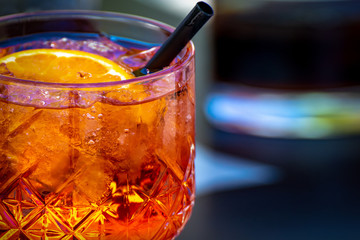 summer cocktail with ice and orange, summer vibes