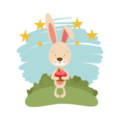 Obraz na płótnie Canvas cute bunny with cake in the hand