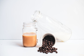cup of coffee and beans on white background