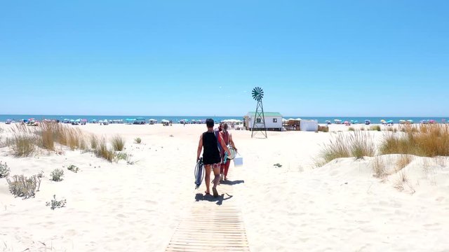 View of People accessing to Punta Umbria Beach in Huelva, Spain