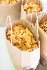 Fresh chanterelle mushrooms in  environmentally friendly paper bags