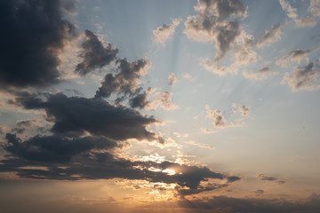 Naklejka na ściany i meble Cloude sky at sunset rays abstract background.