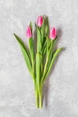 Simple tulips bouquet on the table, seen from above flat lay perspective