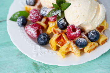 belgian waffles with ice cream and berries