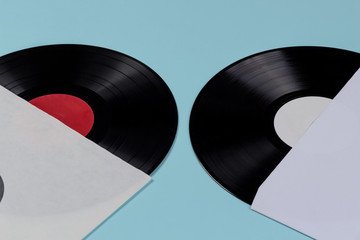two vinyl records inside the cover isolated on blue background