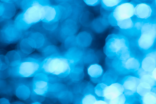 Blue glowing blurred background with bokeh