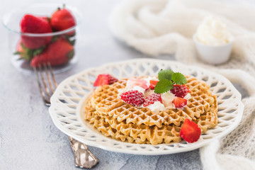 Waffles with strawberries and cream