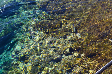 Blue sea water surface. Swimming pool water texture. Blue liquid reflections photo wallpaper. Still rippled water of seashore. Natural water in pool. Seawater texture