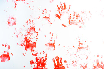 Hands of a little boy painting with watercolors on white paper sheet. Little boy with a brush and paints.  Back to school concept. Copyspace.