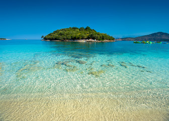 Fototapeta premium Beautiful seascape. Beach on coast of Sea in Albania, Ksamil, near Greece island Corfu