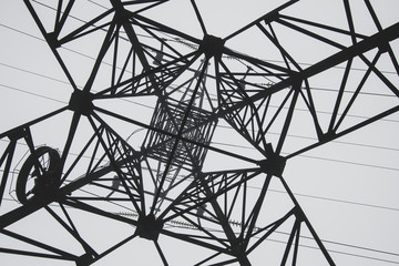 Fototapeta premium Silhouette of transmission lines. High voltage post. Abstract geometric background.
