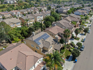 Obraz premium Suburban neighborhood street with big villas next to each other in Black Mountain, San Diego, California, USA. Aerial view of residential modern subdivision luxury house.