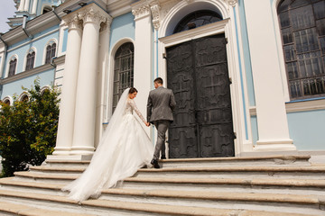Bride and groom go to church on wedding day
