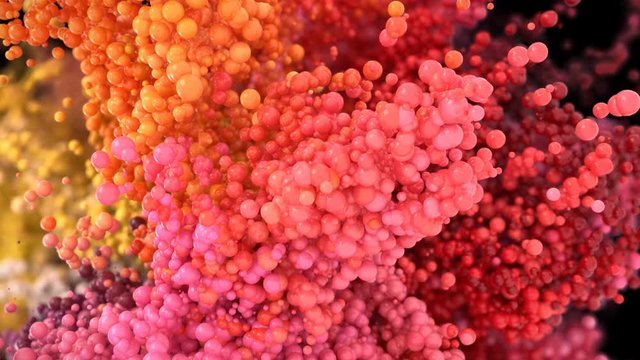 Bubble Burst - colorful orange pink yellow red foaming balls balloons spheres explosion slow motion foam macro isolated on black alpha matte