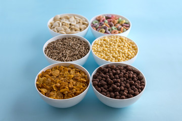 Obraz na płótnie Canvas Variety of colorful cereals for breakfast