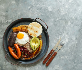 Colombian food. Bandeja paisa, typical dish at the Antioquia region of Colombia - chicharrón...