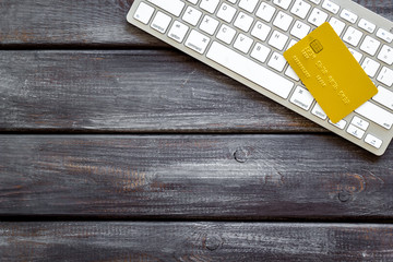 Pay by card concept and keyboard on wooden background top view mock-up