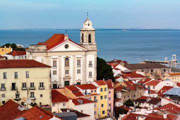 Fototapeta premium Portuguese church and typical portuguese houses with river on the background