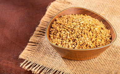 Trigonella foenum-graecum. Fenugreek seeds. Text space