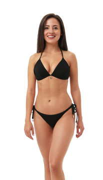 Pretty sexy woman with slim body in stylish black bikini on white background