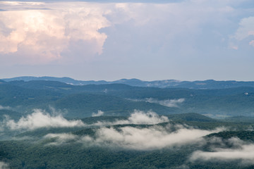 Layers of Appalachian mountains fade into the distance with low lying clouds and fog in North Carolina near Boone and Grandfather Mountain