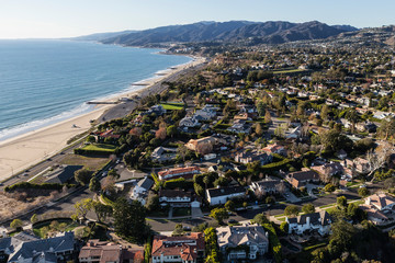 Aerial view of scenic ocean view Pacific Palisades homes and streets in Los Angeles, California.