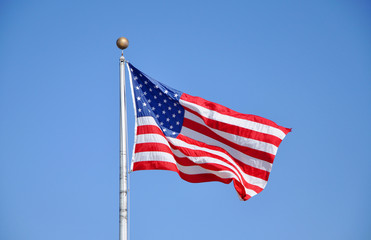 US National Flag against the blue sky.