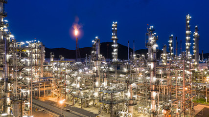Aerial view petrochemical plant and oil refinery plant background at night,  Petrochemical oil refinery factory plant at night.
