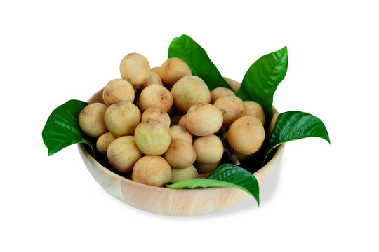 LongKong is placed on a wooden tray. Tropical fruit, Langsat, lanzones, Lansium parasiticum on a white background. - Image