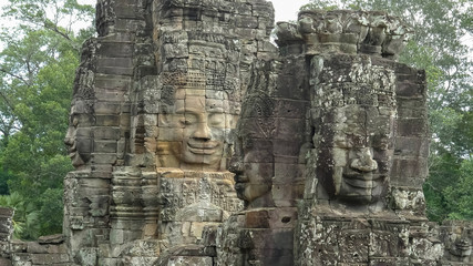 Fototapeta na wymiar four large stone faces at bayon temple