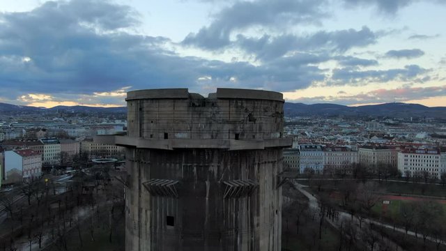 Aerial: Moving Toward and Up Flak Tower with City Behind in Vienna, Austria