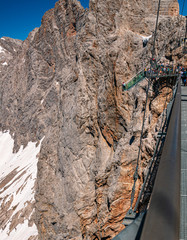 Obraz premium Beautiful alpine view with the stairs into nothing at the famous Dachstein summit, Schladming, Steiermark, Austria