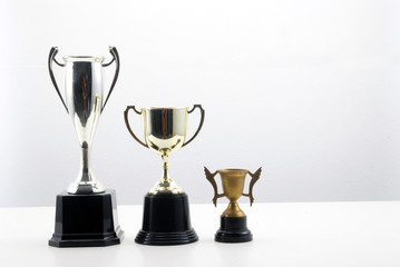 group of trophy on the white table top