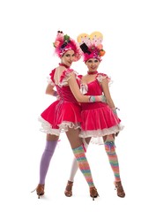 Young female cabaret dancers looking at camera