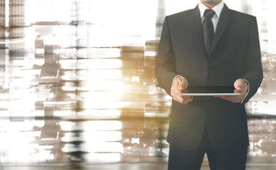 Businessman using digital tablet in hand