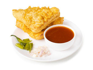 Indian Fried Snack Bread Pakora. It is also known as bread bhaji. A common street food, it is made from bread slices, gram flour, and spices among other ingredients