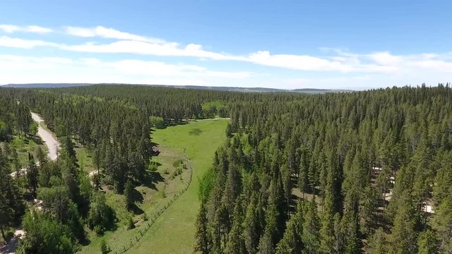 Beautiful landscape of Beartrap Meadow Park outskirts on sunny day. Wyoming USA. Aerial circle pan