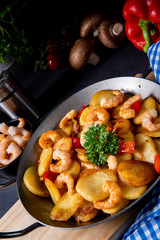 a delicious fried potato and shrimp pan