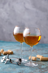 Two glasses with white wine on a textural background. Copy space. Place for your text.
