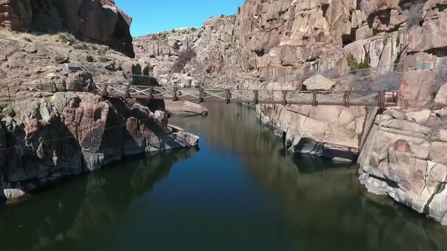 Beautiful landscape over river on sunny day. Pathfinder Dam. Wyoming USA. Aerial traveling