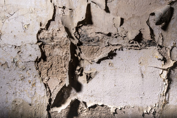 Old wall with cracked paint painting texture background