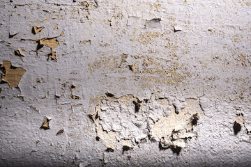 Old wall with cracked paint painting texture background