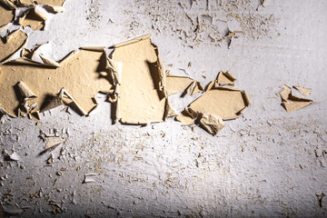 Old wall with cracked paint painting texture background