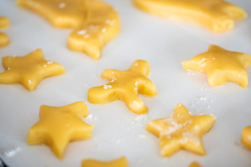 Happy time for kids are preparing the dough, bake cookies in the kitchen, gingerbread man cookies,Christmas baking preparation. 