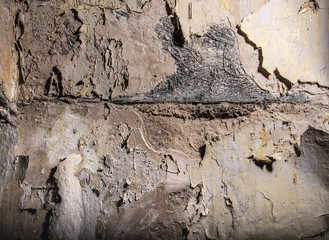 Old wall with cracked paint painting texture background