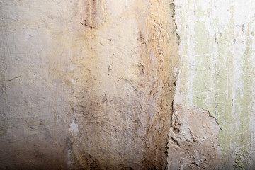 Old wall with cracked paint painting texture background
