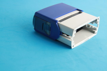 Fototapeta premium Automatic ink stamp manufactured in blue plastic