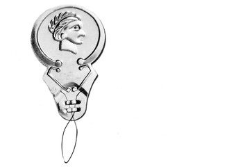 Silver Needle Threader on white background