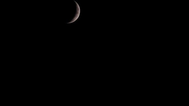 Crescent moon in dark sky, ramadan concept. Time lapse