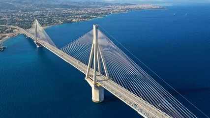 Foto op Aluminium Aerial drone photo of world famous cable suspension bridge of Rio - Antirio Harilaos Trikoupis, crossing Corinthian Gulf, mainland Greece to Peloponnese, Patras © aerial-drone